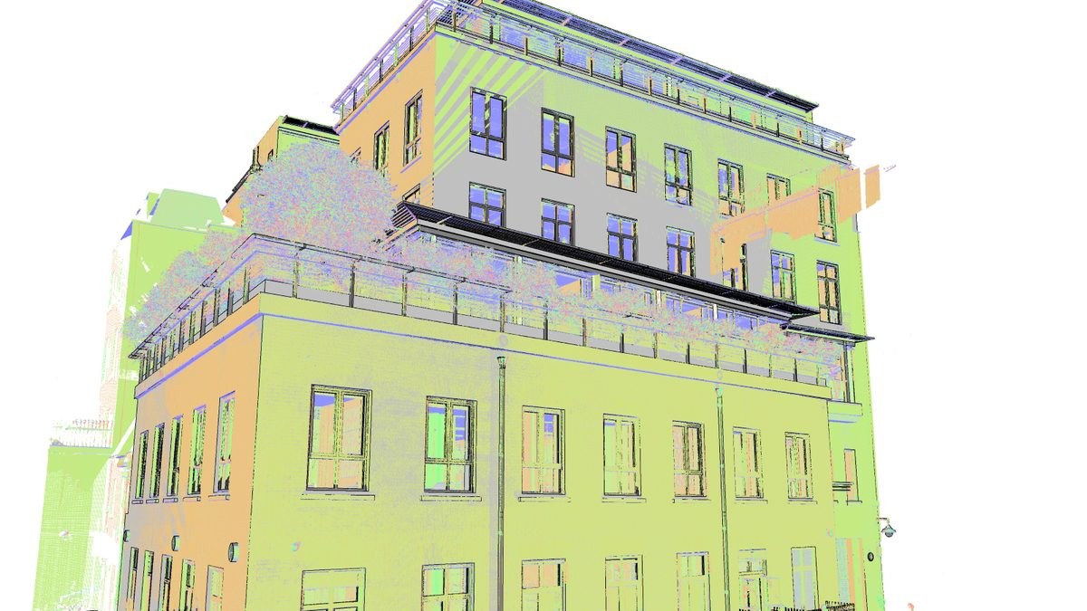 Point cloud overlaid on an architectural BIM model of a multi-storey building