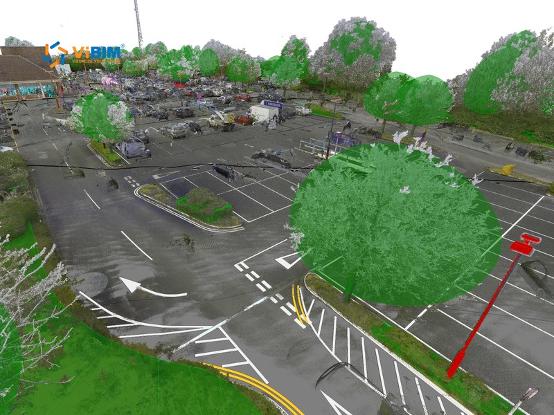 Topography BIM point cloud of a parking lot with asphalt, road markings, grass verges, and trees